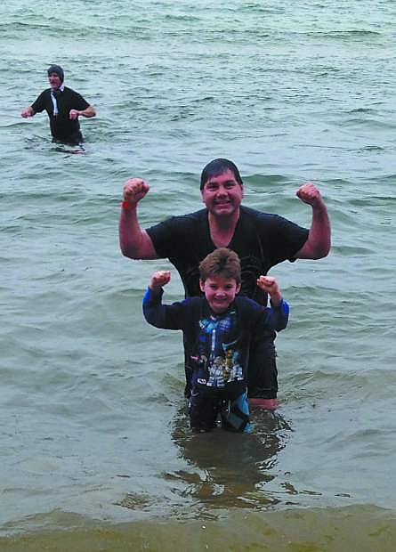 Ted Rupert and his son, Jett, 7, participated in the annual Polar Plunge at Zephyr Cove on Saturday. It is a fundraiser for Special Olympics.