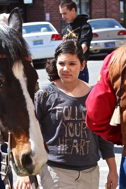 12-year-old Ashley Growell of Carson admires a Pony Express horse Friday afternoon in Telegraph Square.