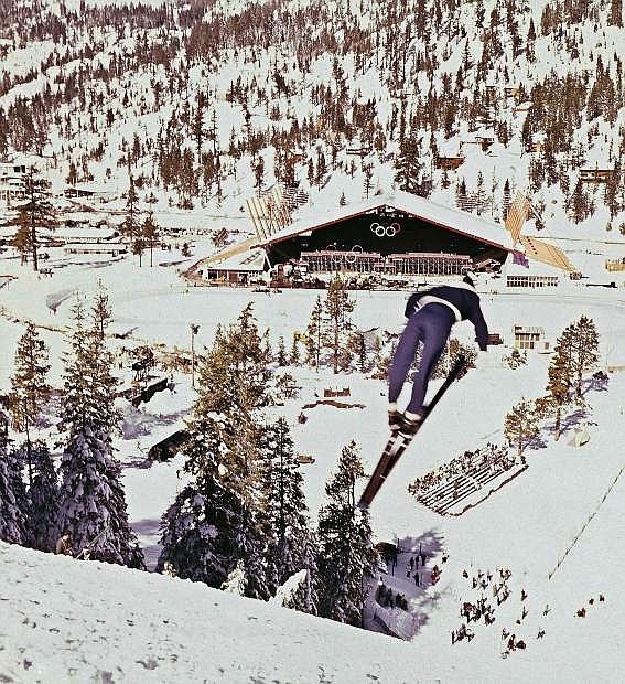 FILE - This Feb. 1, 1960, file photo shows a ski jumper during the 1960 Winter Olympics at the Squaw Valley ski resort in California.  Owners of the Lake Tahoe-area ski resort have agreed to sell Squaw Valley USA to a Colorado-based investment firm that&#039;s pledging $50 million in improvements over the next five years, company officials said Tuesday. (AP Photo/File)