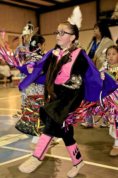 8-year-old Sarah White of the Cheyenne Tribe of Reno dances at the Pow Wow Friday night.