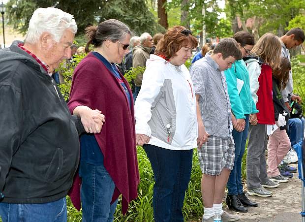 National Day of Prayer attendees join hands to pray Thursday at the Capitol Building.
