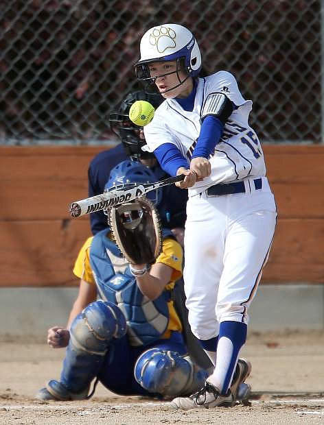 Western Nevada College&#039;s Katilyn Covione hits against Salt Lake Community College at Edmonds Sports Complex in Carson City, Nev., on Fri., Feb. 14, 2014. WNC, who lost 5-14 and 5-7, will play a doubleheader Saturday beginning at noon.