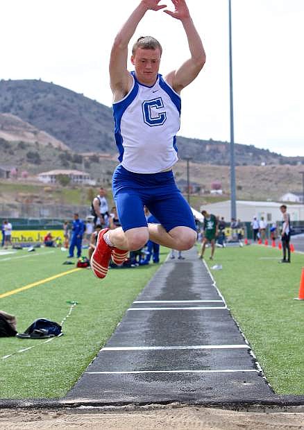 Senior Asa Carter competes in the triple-jump at Damonte High Saturday.