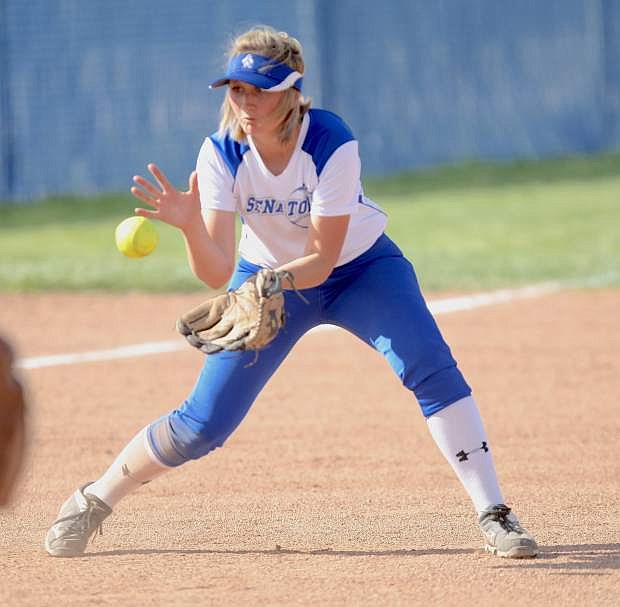 Gabriella Winder scoops up a ground ball at third base in a game against Hug on Tuesday.