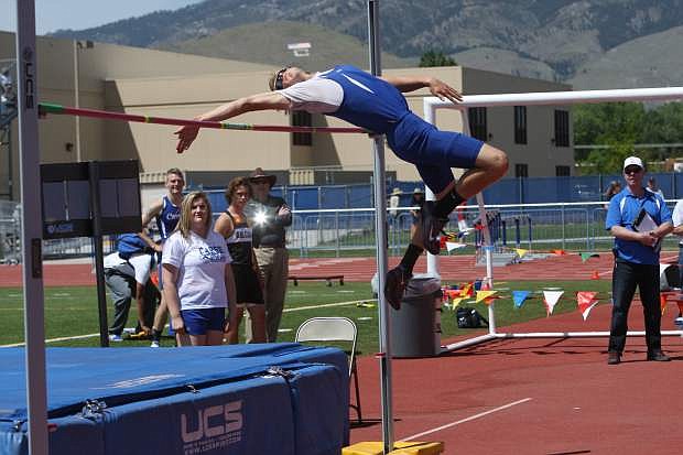 Cody Reid qualfies for the state competition in the high jump at Carson High on Saturday.