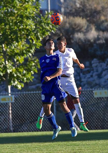 Guillermo Galvan-Hernandez battles for the ball with a Galena player Wednesday in a game that ended in a 1-1 tie at Galena High.