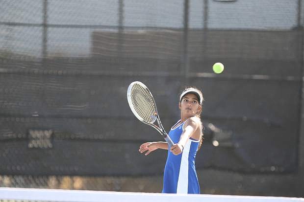 Doubles player Preeta Amin returns a volley in a match against Damonte Ranch on Tuesday.