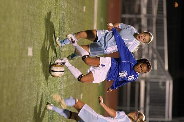 Mayra Olivares passes to a teammate in a game against Reed on Tuesday.