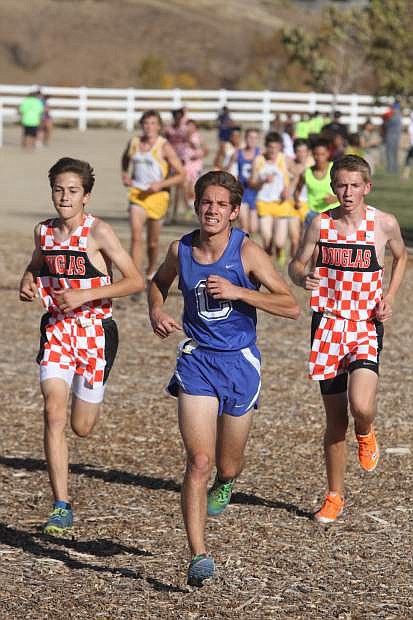Carson&#039;s Tony Cacioppo and John Munyan and Austin Croxall from Douglas compete in the Sierra League race on Thursday.