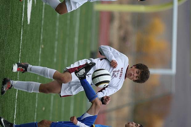 Spencer Ruiz avoids a collision with a South Tahoe player in their match on Tuesday.
