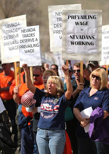 Lisa Contos cheers at a pro-labor rally held to protest a bill that would change the use of prevailing wages in Nevada, on Wednesday, March 27, 2013. Approximately 200 people attended the event in front of the Legislative Building in Carson City, Nev. (AP Photo/Cathleen Allison)