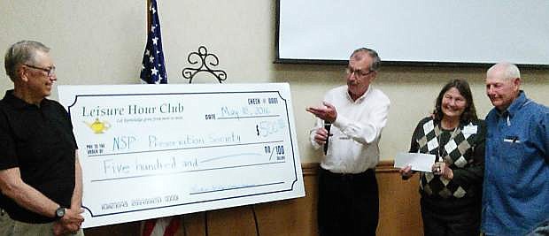 The Leisure Hour Club of Carson City presents a $500 donation to the Nevada State Prison Preservation Society.