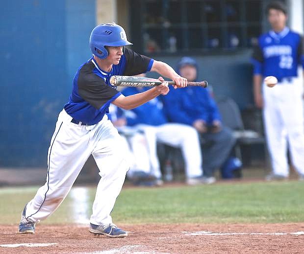 Carson&#039;s Connor Pradere attempts to lay down a bunt in a game earlier this season.