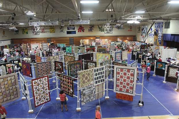 The quilt show takes up all of the gym at Carson High on Saturday. It conitnues today.