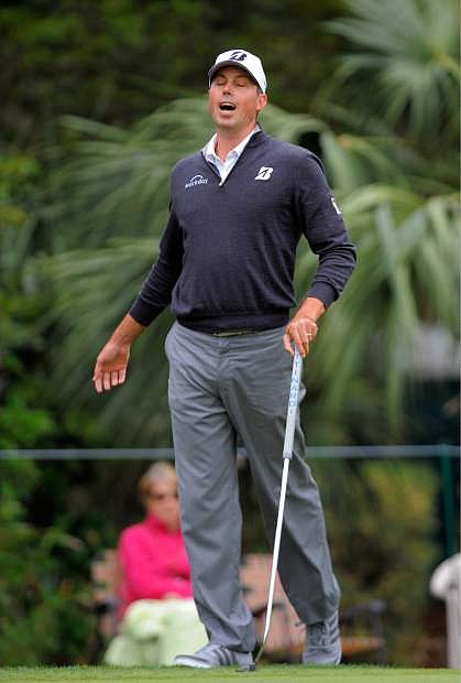 Matt Kuchar reacts after missing a birdie putt on the fifth green during the third round of the RBC Heritage golf tournament in Hilton Head Island, S.C., Saturday, April 19, 2014. (AP Photo/Stephen B. Morton)