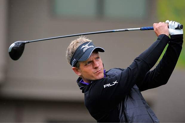 Luke Donald, of England, tees off on the third hole during the second round of the RBC Heritage golf tournament in Hilton Head Island, S.C., Friday, April 18, 2014. (AP Photo/Stephen B. Morton)