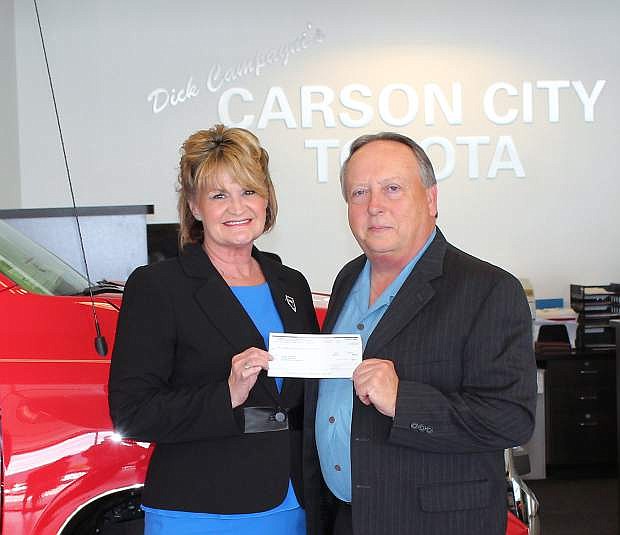 Susan Haas, executive director and CEO of Retired Senior Volunteer Program, accepted a check from Dana Whaley, general manager of Carson City Toyota, on Tuesday.