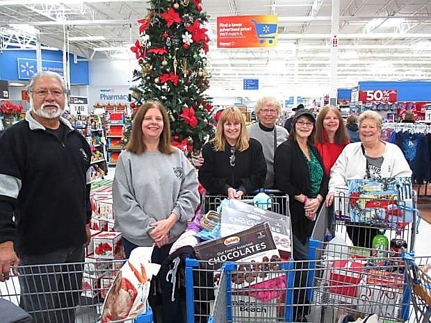 Carson City Raiders Booster Club members went Christmas shopping on Dec. 13 for 11 homebound seniors with funds the club raised at its Christmas Commitment Auction last month.