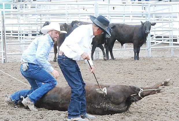 Cowboys beat the clock in &quot;branding&quot; at the 2014 Ranch Hand Rodeo.