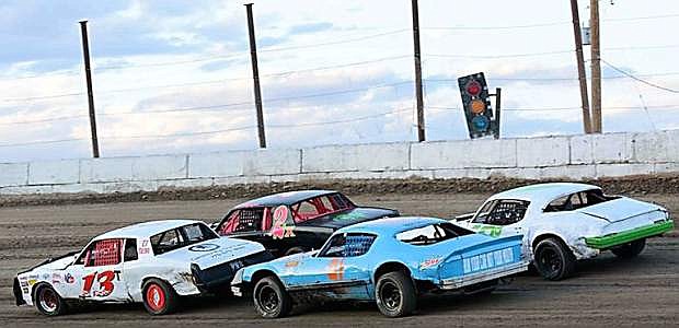 Four cars race to break from the pack on Rattlesnake Raceway.