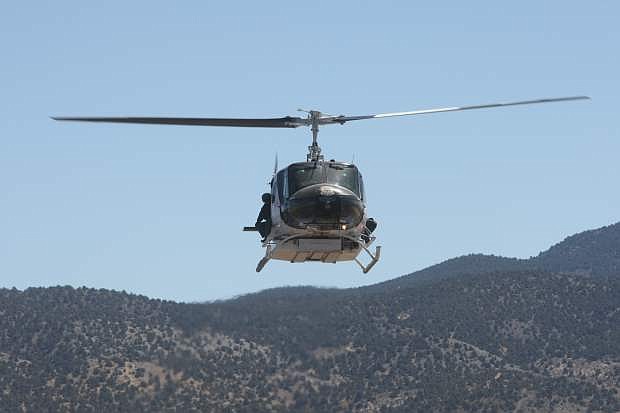 Deputy Larry Lodge of the Washoe County Sheriff&#039;s Office talks about the Regional Aviation Enforcement Unit OH-58 Kiowas during training with Carson City Sheriff&#039;s Office on Wednesday.