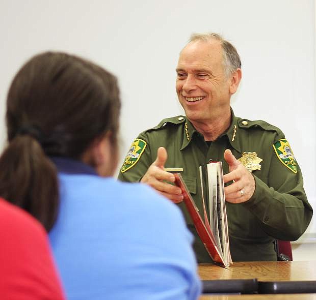 Carson City Sheriff Ken Furlong reads to Nancy Cole&#039;s 5th grade class at Empire Elementary School for Read Week.