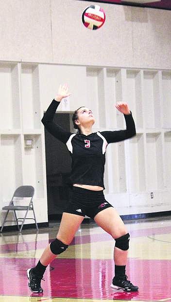 Simpson University defensive specialist Kelsey Reibsamen goes up for the serve during a match in the fall.