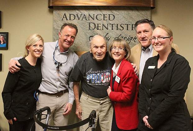 Frank Minervini poses with Advanced Dentristry by Design staff and Assemblyman P.K. O&#039;Neill, second from right.