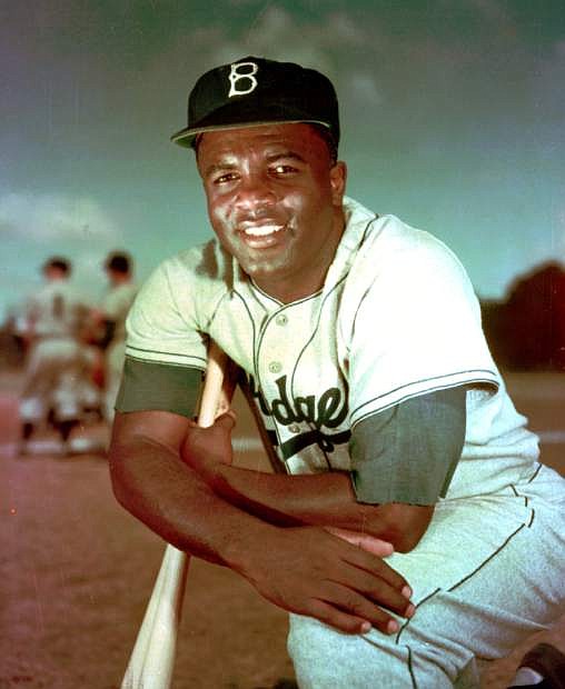 FILE - In this 1952 file photo, Brooklyn Dodgers baseball player Jackie Robinson poses. Baseball holds tributes across the country on Jackie Robinson Day, Tuesday, April 15, 2014, the 67th anniversary marking the end of the game&#039;s racial barrier. (AP Photo/File)