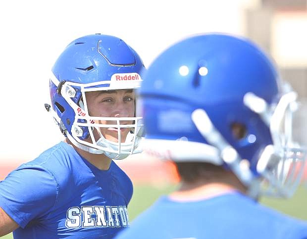 Carson&#039;s Spencer Rogers chats with a teammate during practice Wednesday at Carson High.