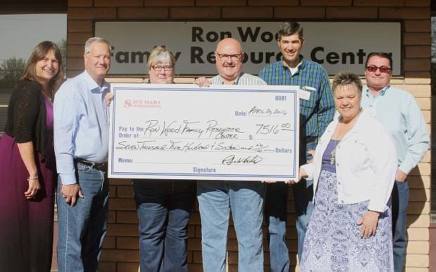 Left to right: Joyce Buckingham, Cal Cheney, Andrea Ochsenschlager, Bob White, Chris Benson and Todd Baldwin. Buckingham, director of the Ron Wood Family Resource Center accepts a $7,516 donation from the local store managers and district manager of SaveMart to go towards their food bank. &quot;We can&#039;t tell you how much this means to us,&quot; Buckingham said. &quot;Thank you for all that you have done.&quot;