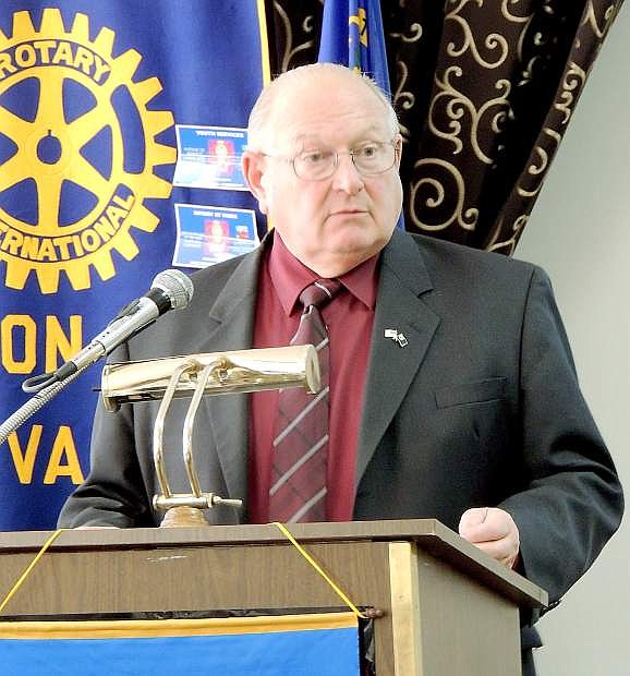 Hugh Gallagher III, Storey County comptroller, talks about Tesla Motors impact to the region Tuesday at Rotary.