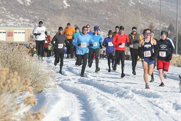 Runners take off from Western Nevada College for Saturday&#039;s Running with Rudolph in Ash Canyon. The trail run drew about 90 participants as part of the Be Bold, Run in the Cold Winter Trail Series presented by Ascent Runs. Runners could participate in a 5K or 7-mile run.