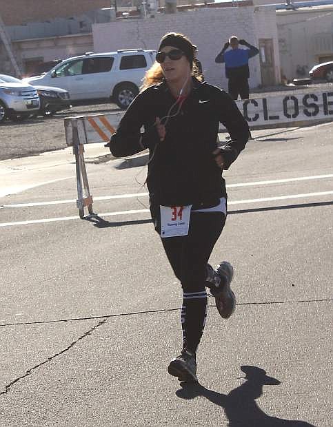 Rebekah Woolsey runs toward the finish line during the annual New Year&#039;s 5K Fun Run/Walk on Saturday. Woolsey won the women&#039;s overall race with a time of 10 minutes, 27 seconds.