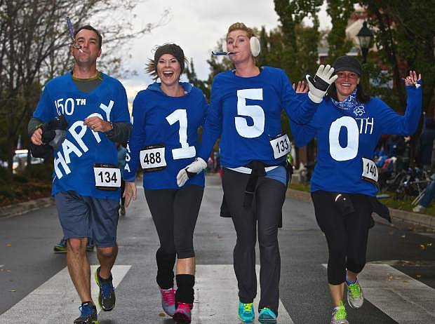 A quartet of 8k runners show their Nevada Day spirit in wishing the Silver State a happy 150th.