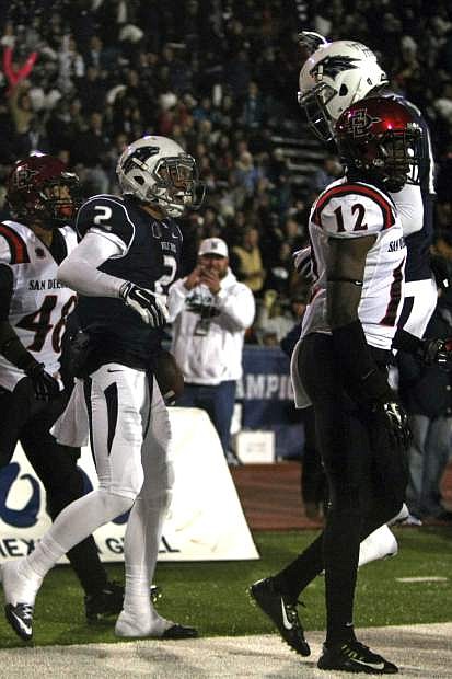 Nevada wide reciever Richy Turner (2) celebrates his second-quarter touchdown against San Diego State during an NCAA college football game in Reno, Nev., Saturday, Nov. 1, 2014. (AP Photo/Lance Iversen)