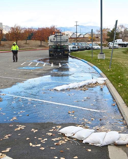 It is flood awareness week and Carson City Public Works Senior Street Technician Charlie Noftsker demonstrates the difference between diversion (background) and detention (foreground) sandbagging techniques on Thursday at Mills Park. For more information visit NevadaFloods.org