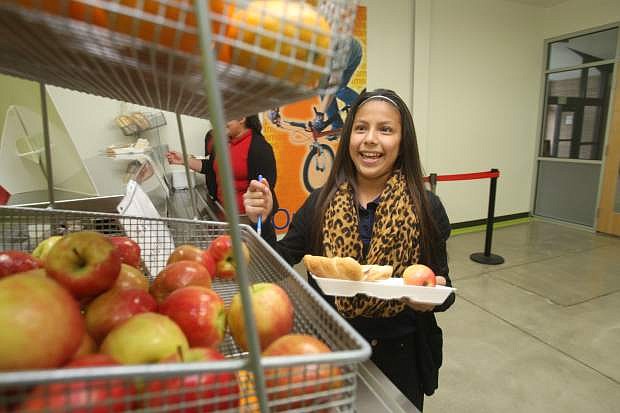 Eagle Valley Middle School seventh grader Yanitzia Perez eyes the fruit basket during lunch break.