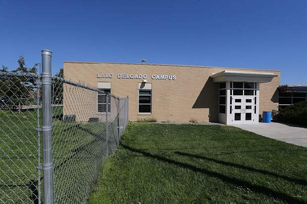 This Friday, Sept. 19, 2014 photo shows the exterior of the Lalo Delgado school campus in Denver.   Four students were injured, one seriously, when a teacher was pouring methanol onto a table top and igniting it during a chemistry class demonstration last Monday.  Educators and investigators say some teachers lack the training required by law and don&#039;t know about standard safety measures that can dramatically lower the inherent dangers of hands-on experiments  they say are vital to science education. (AP Photo/Brennan Linsley)