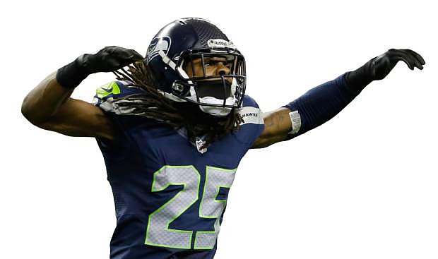 Seattle Seahawks&#039; Richard Sherman celebrates after the Seahawks score a safety in the first half of an NFL football game against the San Francisco 49ers, Sunday, Sept. 15, 2013, in Seattle. (AP Photo/Elaine Thompson)