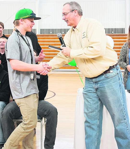 Fallon&#039;s Sean McCormick, left, shakes hands with Mayor Ken Tedford in March when the city honored the Wave state champion wrestling team.
