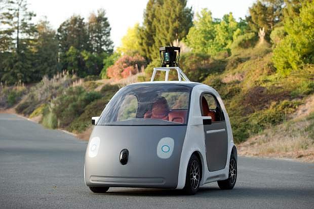 This undated image provided by Google, shows an early version of Google&#039;s prototype self-driving car.  For the first time, California&#039;s Department of Motor Vehicles knows how many self-driving cars are traveling on the state&#039;s public roads. The agency is issuing permits, Tuesday, Sept. 16, 2014 that let three companies test 29 vehicles on highways and in neighborhoods.  (AP Photo/Google, File)