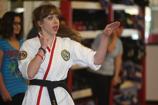 Seventeen-year-old Emily Eiswert explains a self defense move on Saturday morning at Carson ATA Martial Arts. Eiswert hosted a women&#039;s self defense class as part of her Carson High School senior project. She also collected paper goods for Advocates to End Domestic Violence.