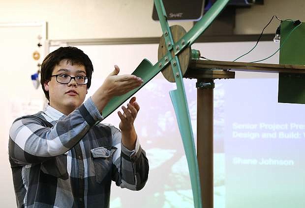 Shane Johnson, 18, explains how he created a windmill as his Senior Project at Carson High School in Carson City, Nev., on Monday, April 18, 2016. After their year-long research projects, CHS seniors make presentations to a panel of judges made up of community members.