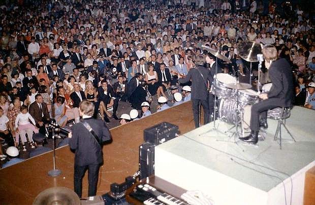 On This Date: August 20, 1964, The Beatles played at the Las Vegas Convention Center. Originally slated to play at the Sahara Hotel, but the venue could only hold 600 people, so it was moved to the nearby Las Vegas Convention Center. Over 8,000 fans saw the shows and The Beatles earned $30,000 for their two performances.