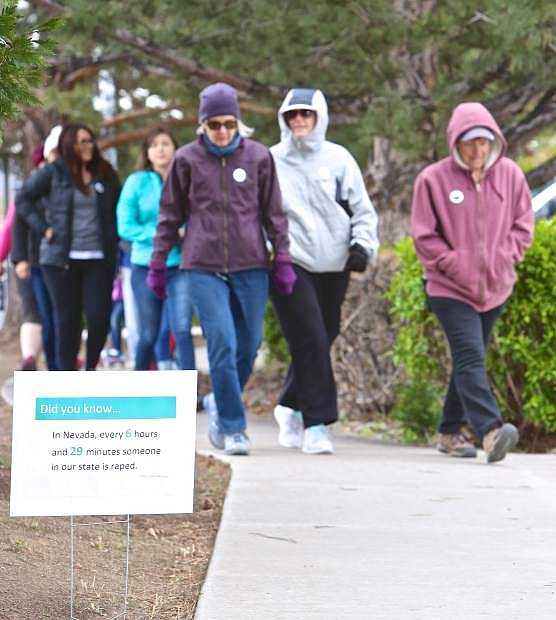 WNC students and supporters start the Sexual Assault Awareness Walk from the corner of West College Pkwy. and N. Carson St. Saturday morning. On arrival at the WNC campus, walkers heard from speakers, enjoyed refreshments, and gained information geared towards our community.