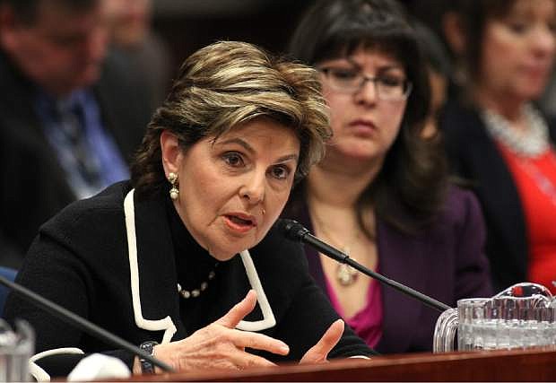 Attorney Gloria Allred and Assemblywoman Irene Bustamante Adams, D-Las Vegas, right, urge lawmakers to support a bill that would remove the criminal statue of limitations for sexual assault cases in Nevada during a hearing at the Legislative Building in Carson City, Nev., on Friday, March 13, 2015. (AP Photo/Cathleen Allison)
