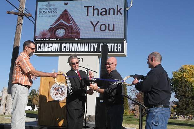 Roger Moellendorf, parks and recreation director, Carson City Mayor Bob Crowell,Stan Jones, former chairman of the chamber of commerce and Mitch Ames, recreation operations manager, cut the ribbon for the Carson Community Center sign on Wednesday.