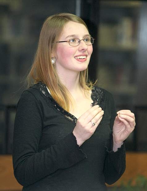 Carson High School American Sign Language II student Jourdan Snyder signs the song &quot;Thanks for the Memories&quot; at the school&#039;s Sign Me A Song presentation on Tuesday night.