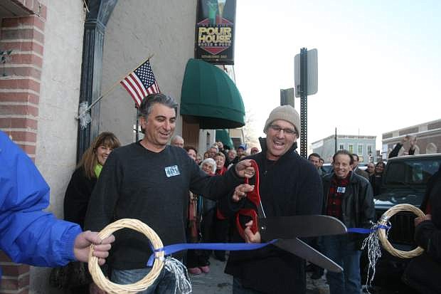 Dan Shaheen and Rowan Colgan cut the Carson City Chamber of Commerce ribbon at the renaming of Mo &amp; Sluggo&#039;s to Westside Pour House Booze &amp; Food on Thursday afternoon.